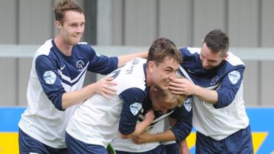 Ballinamallard players celebrate with goalscorer John Currie