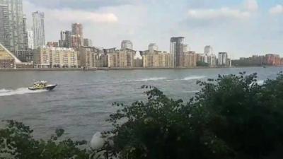 Onlookers caught sight of police chasing people riding jet skis in London.