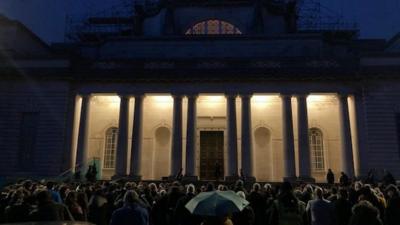 People gathered at a candlelit vigil