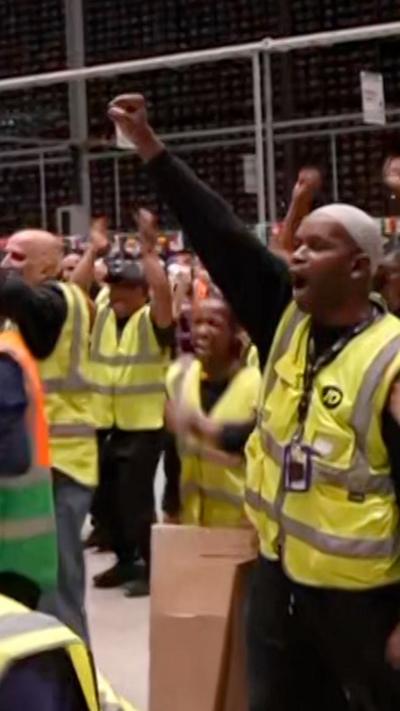 Worker in a warehouse celebrate 