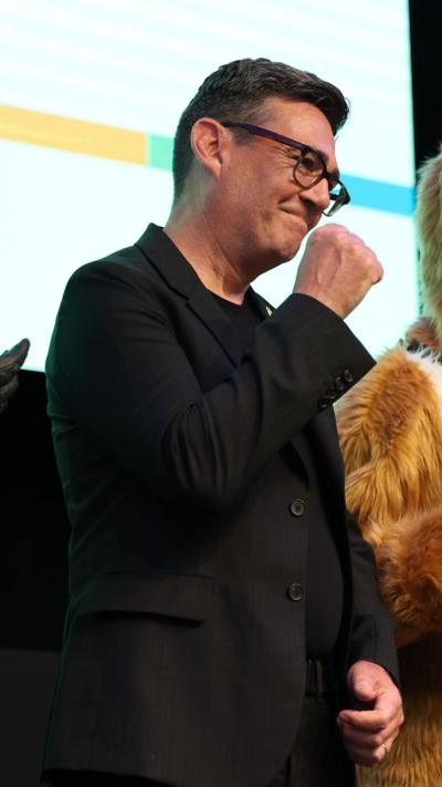 Andy Burnham punches the air in celebration