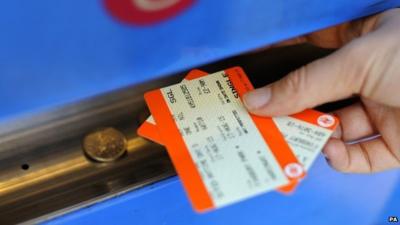 Person buying a train ticket