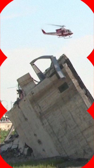 A helicopter flying over part of a collapsed bridge