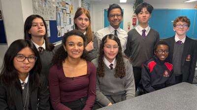 Nina with school children and the person in charge of online safety in the UK, MP Kanishka Narayan