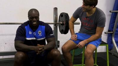 AFC Wimbledon's Adebayo Akinfenwa with OJ Borg