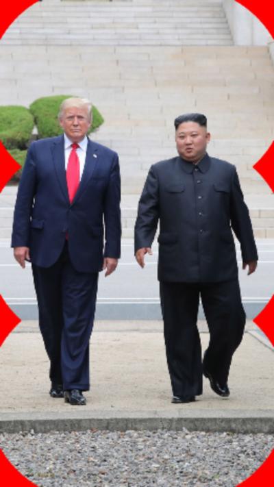 Donald Trump (left) walking alongside Kim Jong un (right). They are both walking towards the camera.