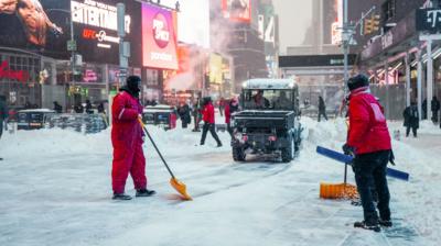 Teams work to clear the snow in New York City