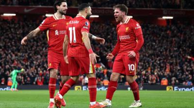 lexis Mac Allister of Liverpool celebrates scoring his team's second goal with teammates Dominik Szoboszlai and Mohamed Salah during the Premier League match between Liverpool FC and Newcastle United FC at Anfield on February 26, 2025