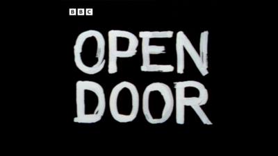 Black background with the words 'Open Door' written on it in white