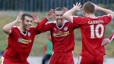 Cliftonville's David McDaid, Martin Donnelly and Stephen Garrett celebrate scoring against Ballymena