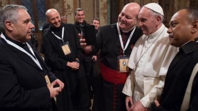 'Missionaries of Mercy' pose for a selfie with the Pope