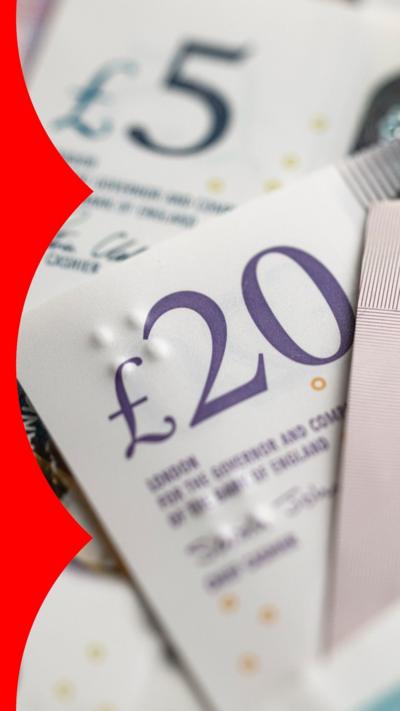 A £20 note on top of a £5 note