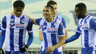 Ivan Toney, on loan at Wigan from Newcastle, celebrates scoring the opening goal