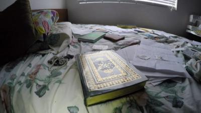 Books and documents on bed