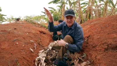 BBC reporter taking cover in jungle area