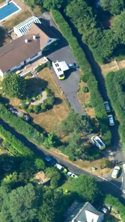 Aerial view of a large home with a pool 