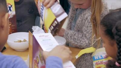 Children pouring cereal