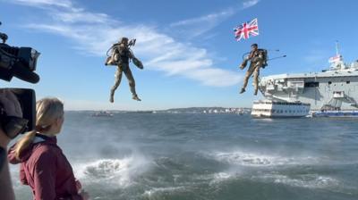 Two jet packs fly over New York Harbour