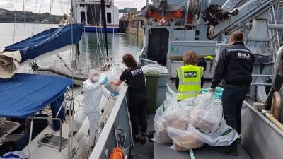 Officers searching the vessel