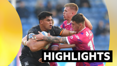 Hull FC's Herman Ese'ese is tackled by Huddersfield Giants' Thomas Deakin