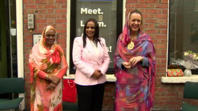 Belfast Lord Mayor Kate Nicholl with two women from the city's African community