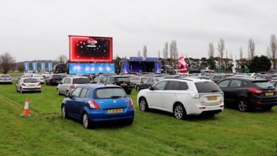 Cars parked at the drive-in Christmas show