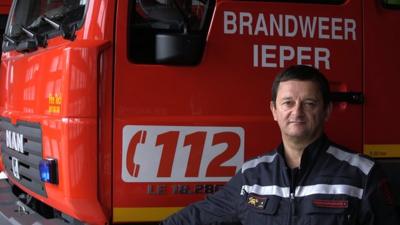 Fire chief Rik Vandekerckhove in front of a fire engine