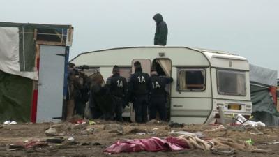 Riot police in Calais migrant camp the 'Jungle'