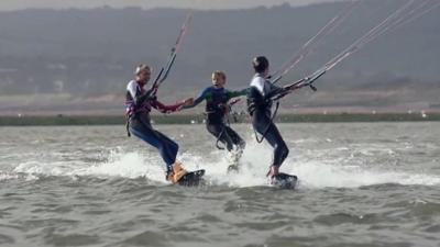 kite surfers on the sea