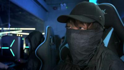 A Hong Kong gamer and protester. They are dressed to protect their anonymity.