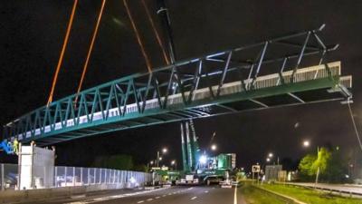 Pedestrian footbridge installed across A45