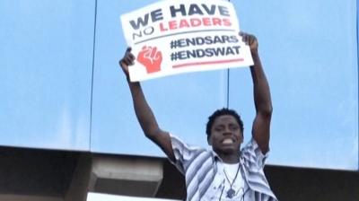 Protester waving a placard