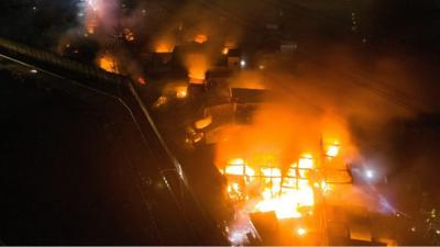 residential area after fire broke out at a fuel storage station operated by Indonesia's state energy company