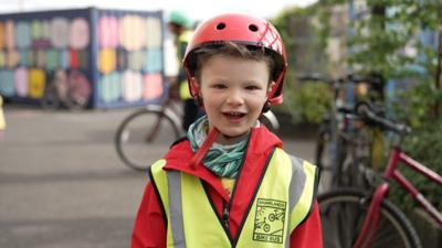 The scheme is organised by parents, who provide a wall of protection between children and traffic.