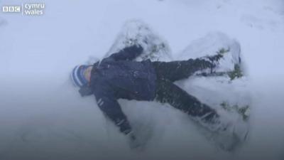 A child in Tintern making a snow angel