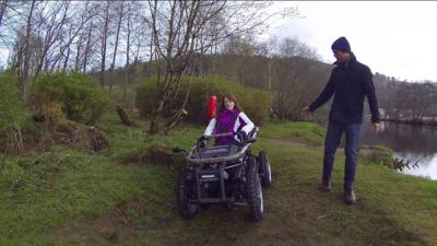 Woman using an all-terrain wheelchair