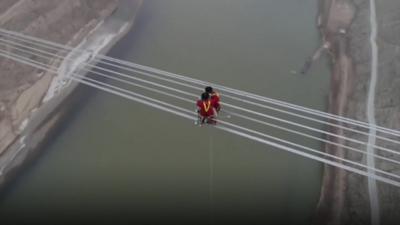 Workers on power lines in China