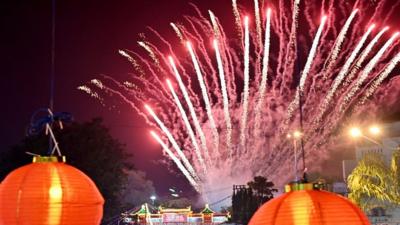 Fireworks explode over lanterns to celebrate the lunar new year in Solo, Central Java