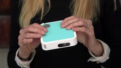 Lara Lewington holds the ViewSonic M1 mini Plus