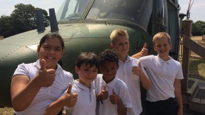 Pupils with the helicopter at their school