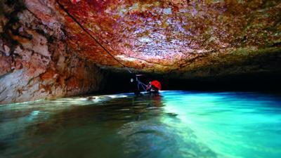 Spanish scuba diver Xisco Gràcia exploring an underwater caves