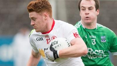 Tyrone's Conor Meyler is challenged by Fermanagh forward Ruairi Corrigan