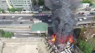 A pylon on fire in the Philippines.