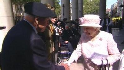 The Queen meets a veteran outside St Martin-in-the-Fields church in London