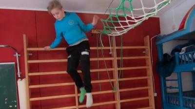 Juha Jarvinen's son plays in his room