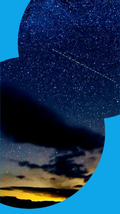Dark clouds against a starry early morning sky