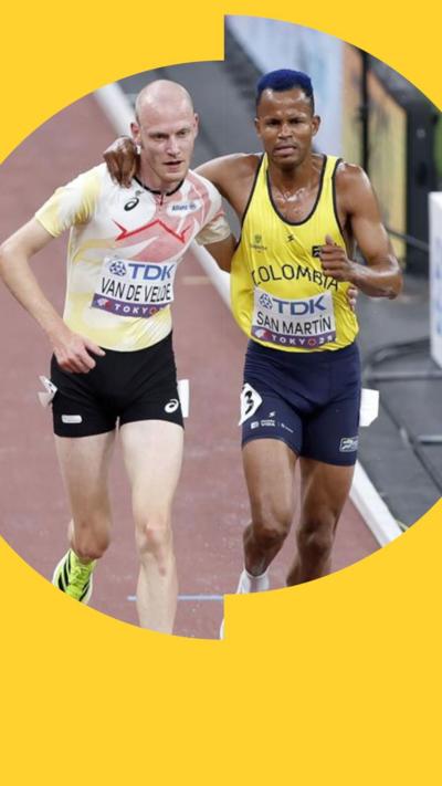 Two runners embrace during a race