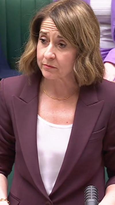 Liz Kendall wears a purple suit