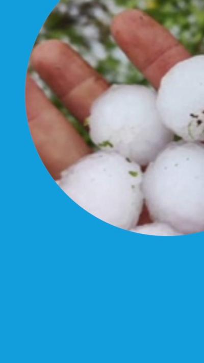 Giant hailstones held in someone's hand.