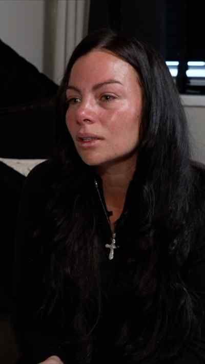 A woman with dark hair looking to the right